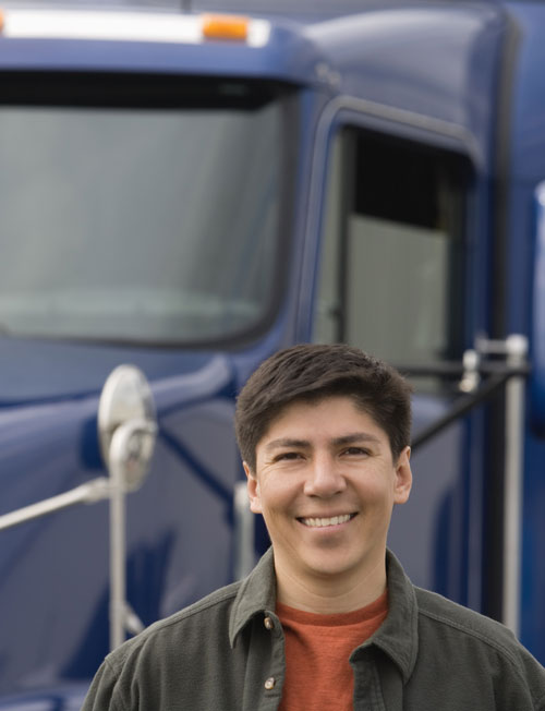 young man in front of his truck